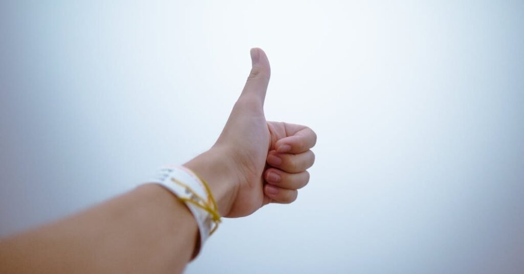 pexels-photo-193821-193821 A hand giving a thumbs up gesture symbolizes approval and positivity.